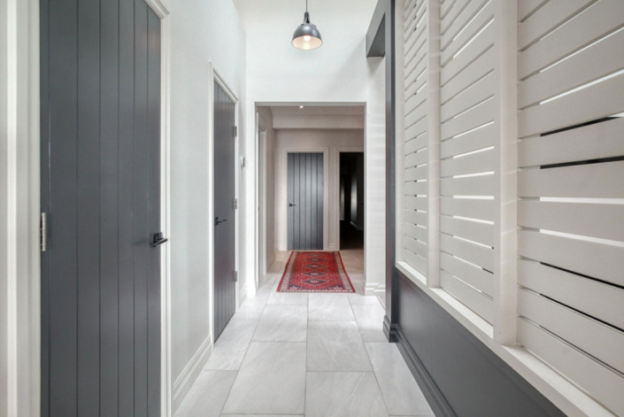 A stunning hallway with custom finishes by your Brantford local home builder, Haggerty Homes.
