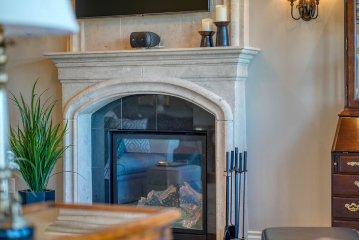 An elegant stone fireplace by your custom home contractor, Haggerty Homes.