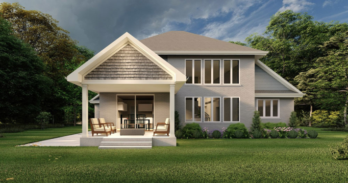 Rear view home rendering of the Peak Model with many windows and a beautiful patio in the Summit Estates development.